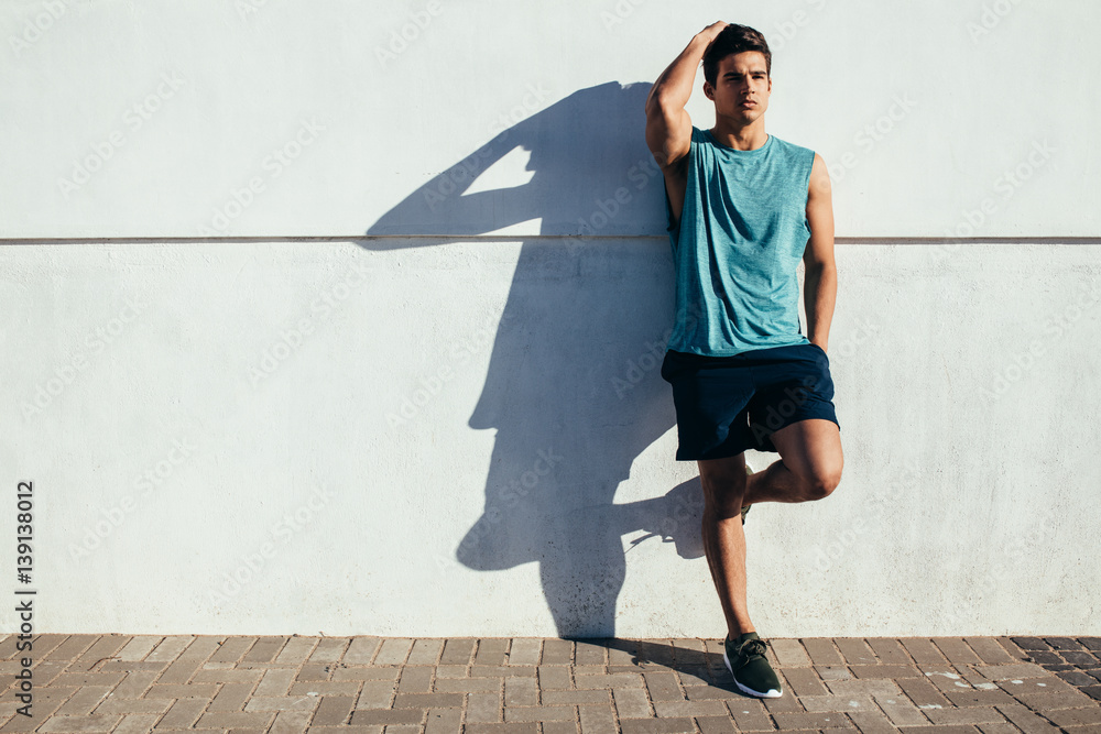 Sportsman relaxing after running exercise