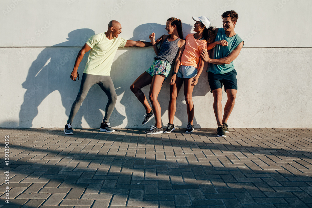 Fitness group having fun outdoors