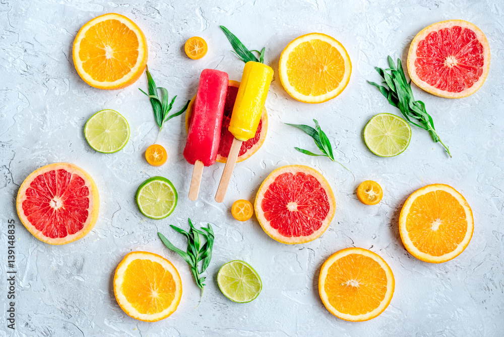 homemade ice-cream with oranges and lime on table top view pattern