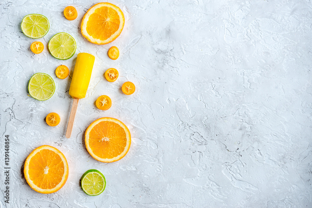 Orange icecream with fruits on table background top view mock-up