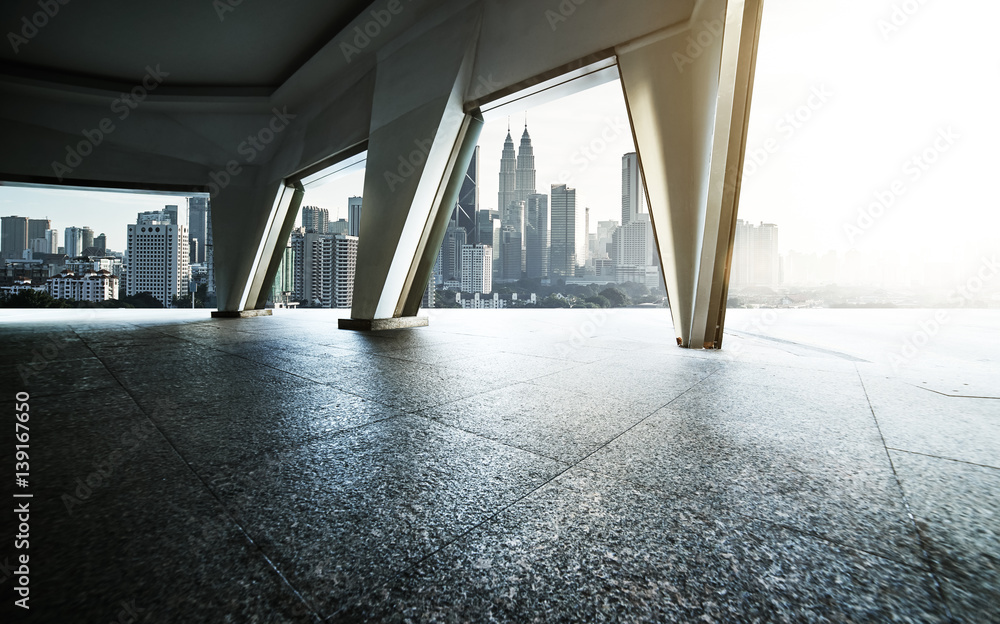 Cityscape skyline view from empty space corridor with marble floor .