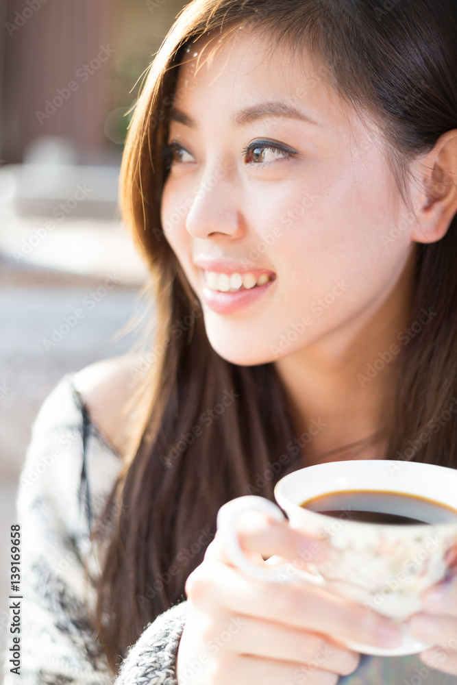 young pretty woman sits in cafe