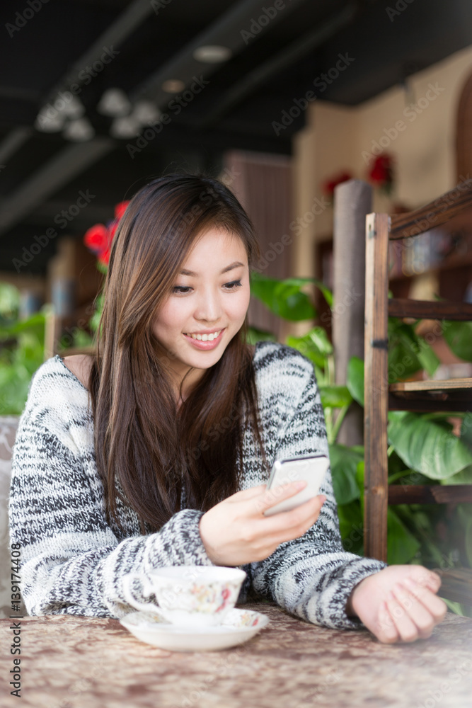 young pretty woman sits in cafe