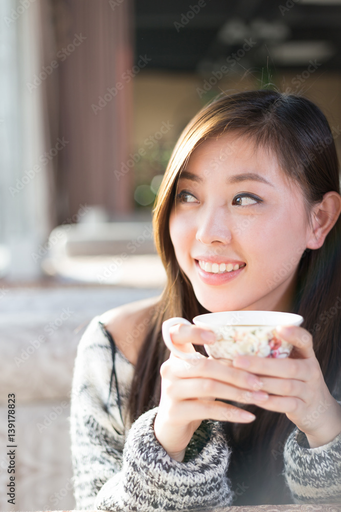 young pretty woman sits in cafe