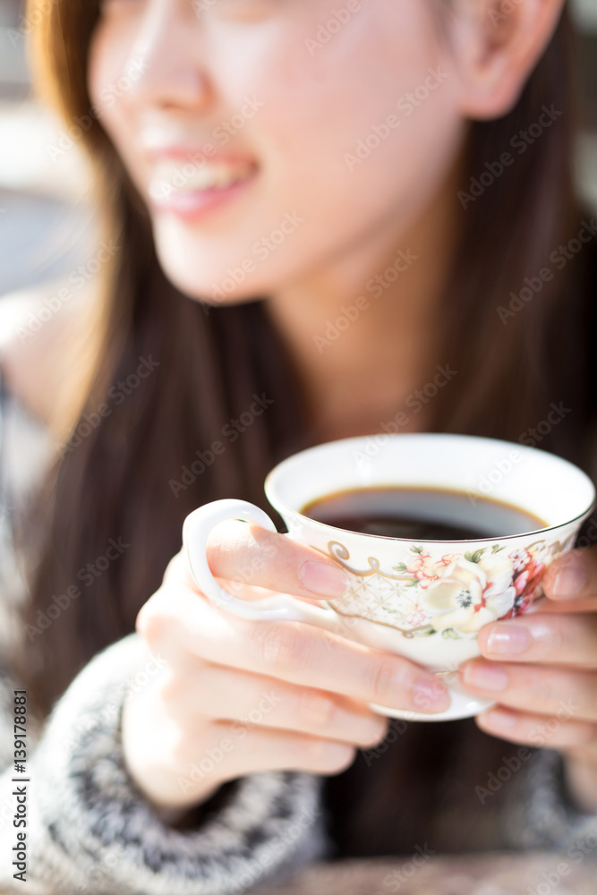 young pretty woman sits in cafe