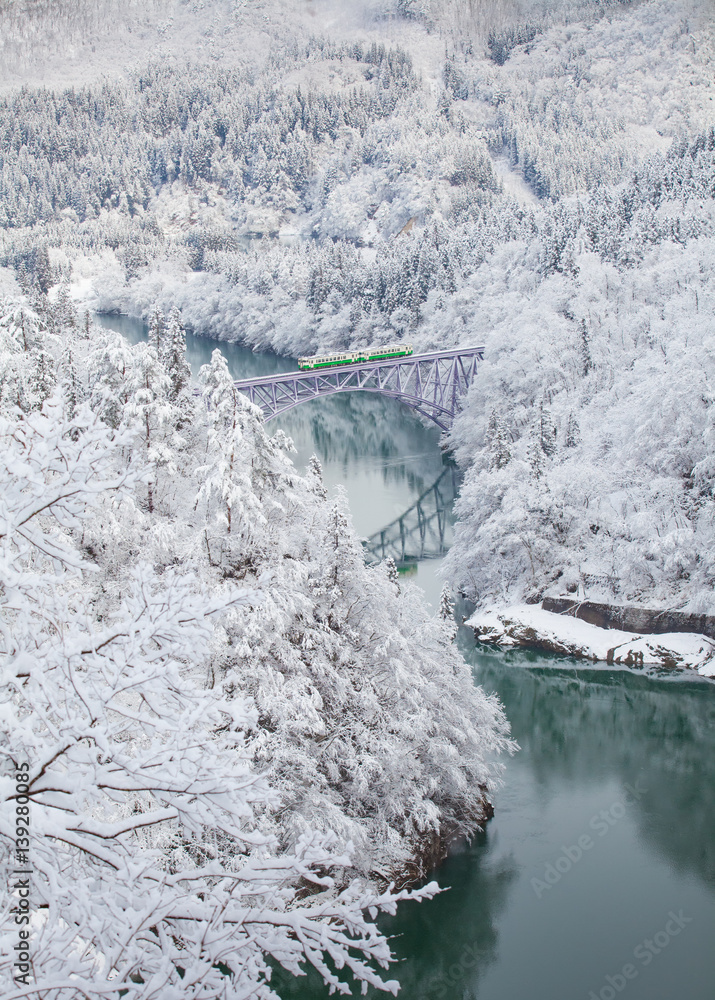 Japan mountain and snow with local train in winter season at Mishima town , Fukushima prefecture