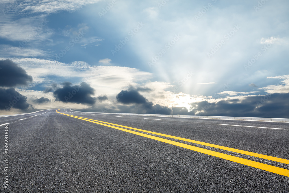    Asphalt road and sky at dusk