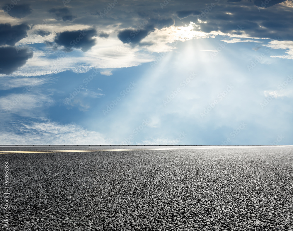 asphalt road under the blue sky