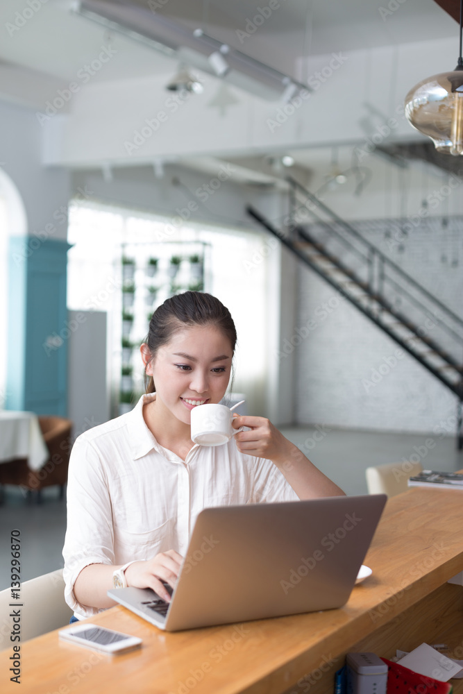 young pretty woman relaxes in office