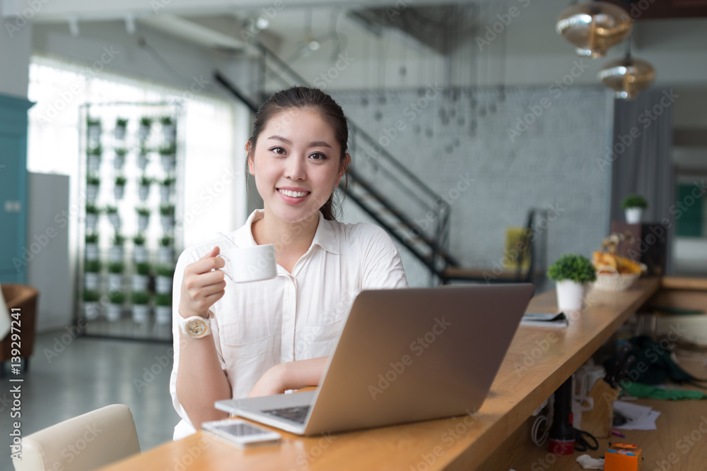 young pretty woman relaxes in office