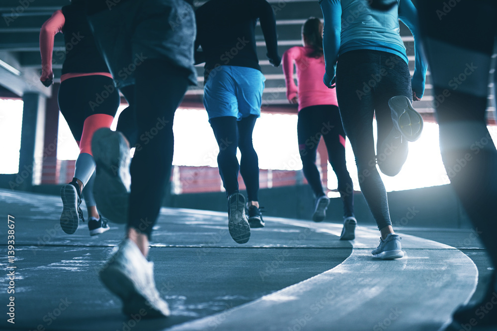 Young athletes training on race track