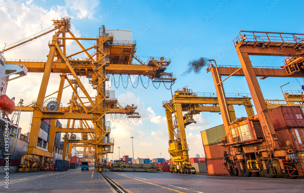 container ship in import export and business logistic.By crane ,Trade Port , Shipping.cargo to harbo