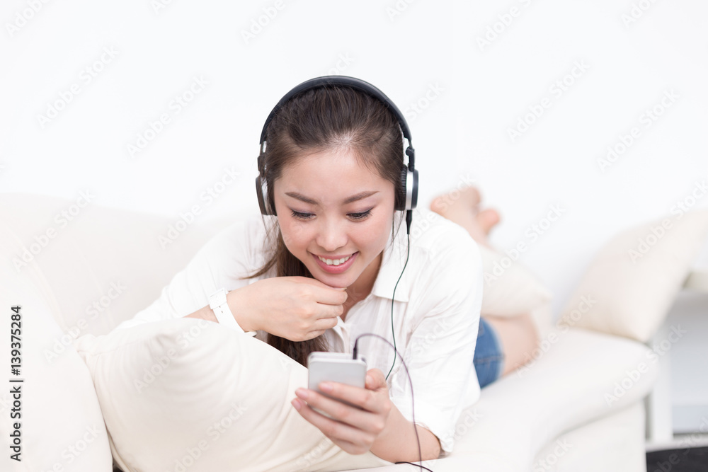 young pretty woman relaxes with mobile phone