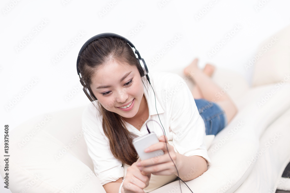 young pretty woman relaxes with mobile phone