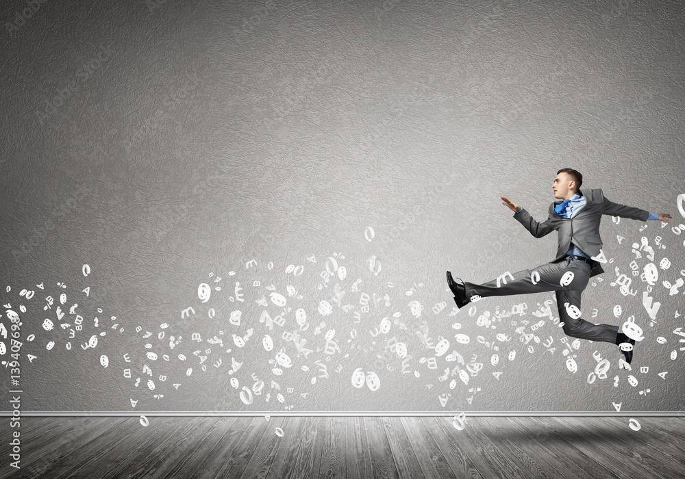 Businessman jumping high