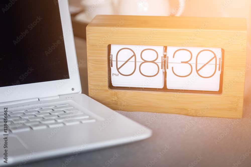 morning time with wood alarm clock and notebook