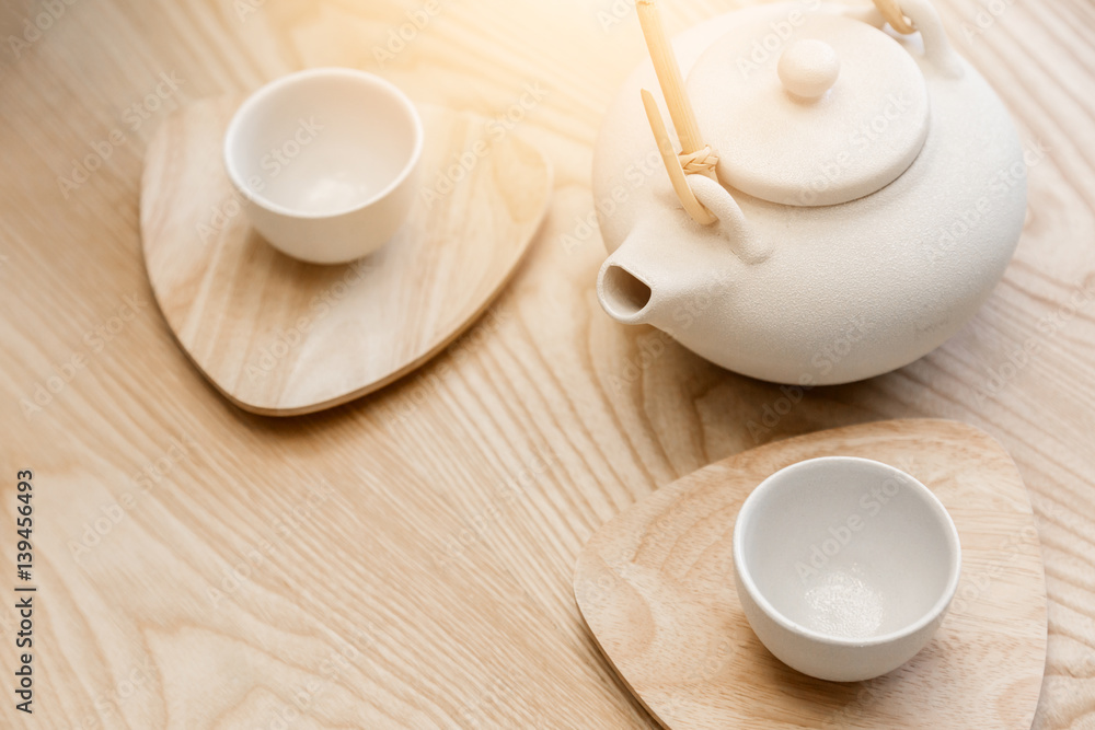 asian tradition white ceramic set on wooden table background with nature light