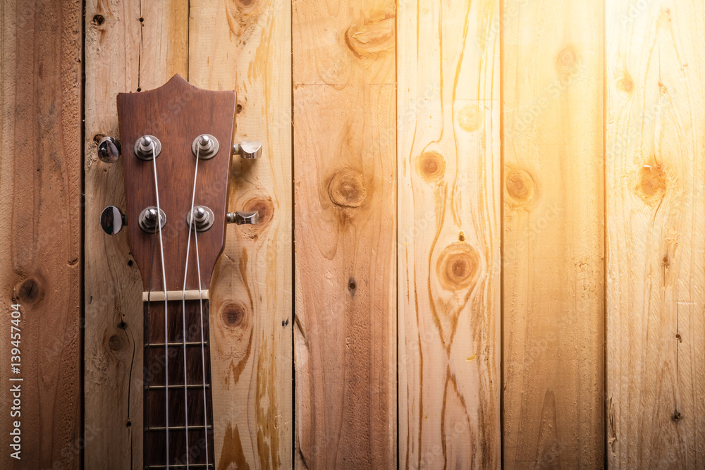 ukulele on old wooden floor with free copyspace