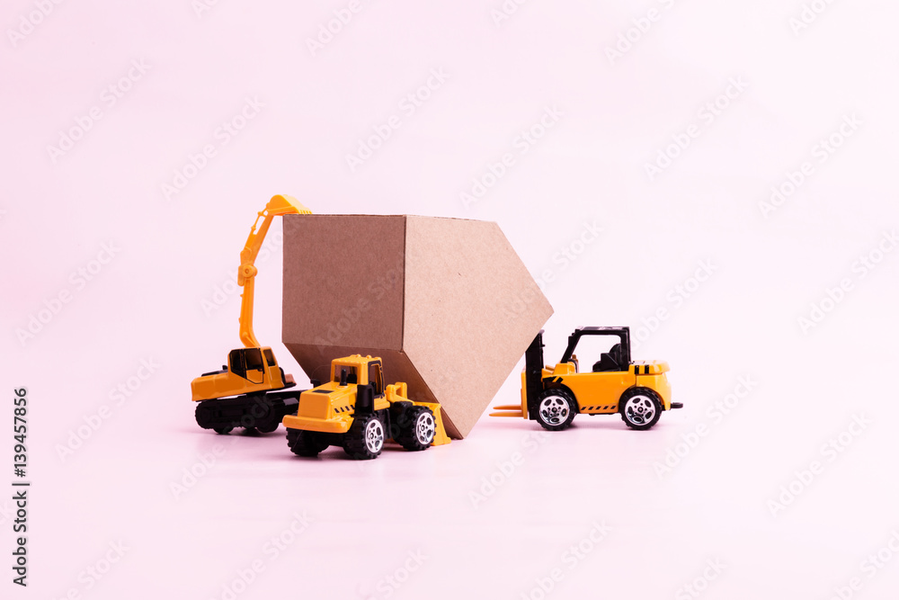 house construction business ideas concept with house cardboard paper and toy car with free copyspace