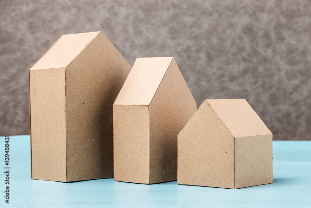 three house model cardboard with free copyspace house loan business concept