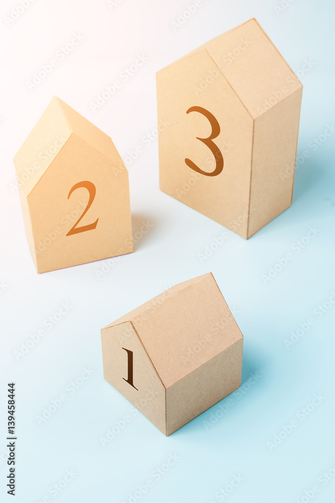 three house model cardboard with free copyspace house loan business concept