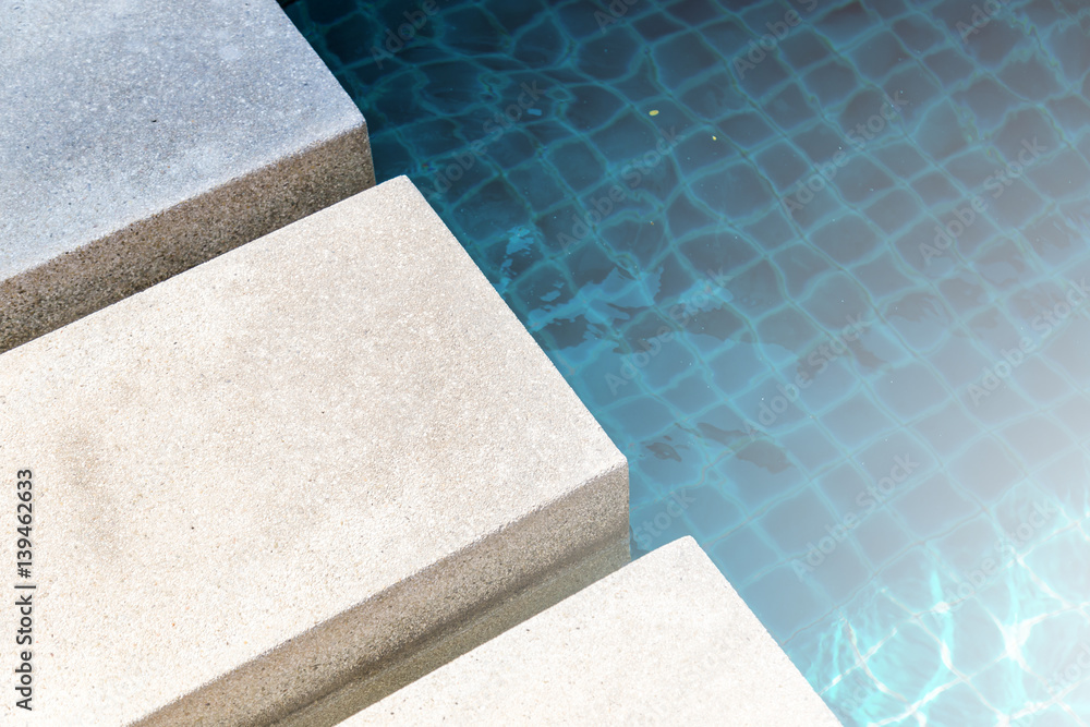 light color cement pavement with swimming pool access