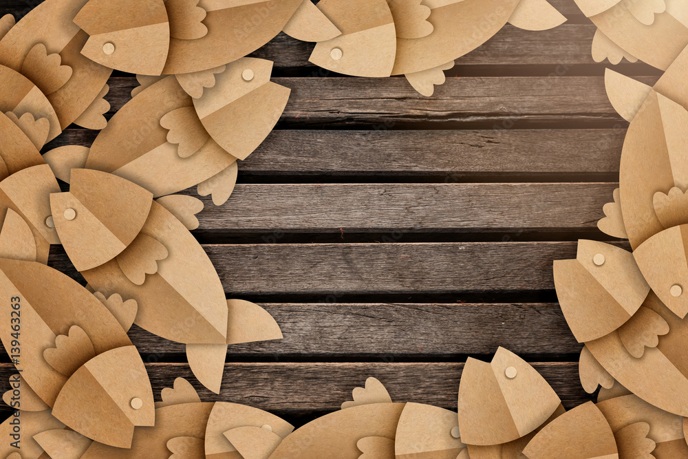 old rustic wood plank background with fish paper cut and free copyspace