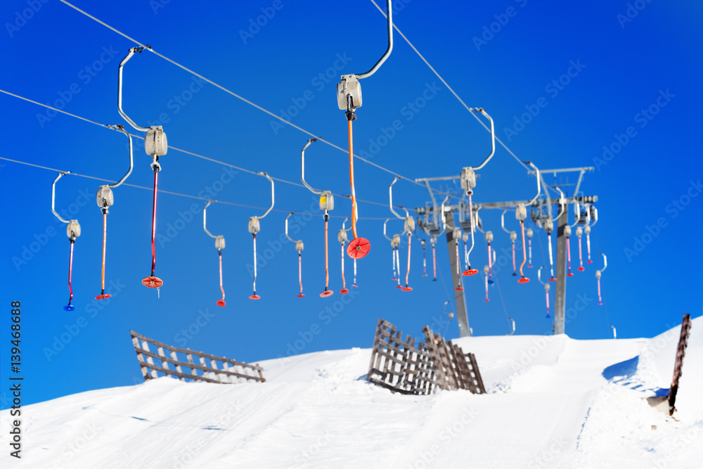 Empty button lifts of ski resort in wintertime