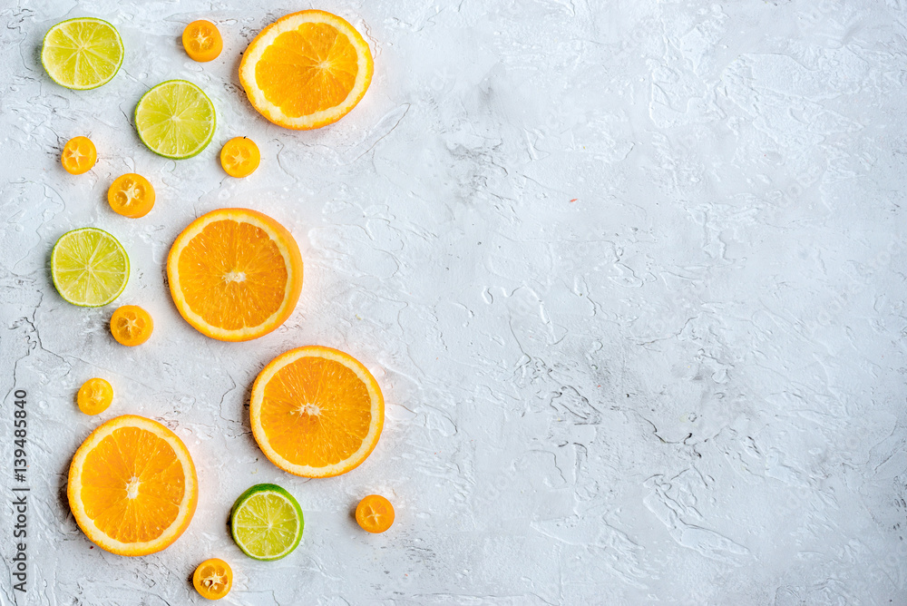 sliced citrus on stone table background top view mock up