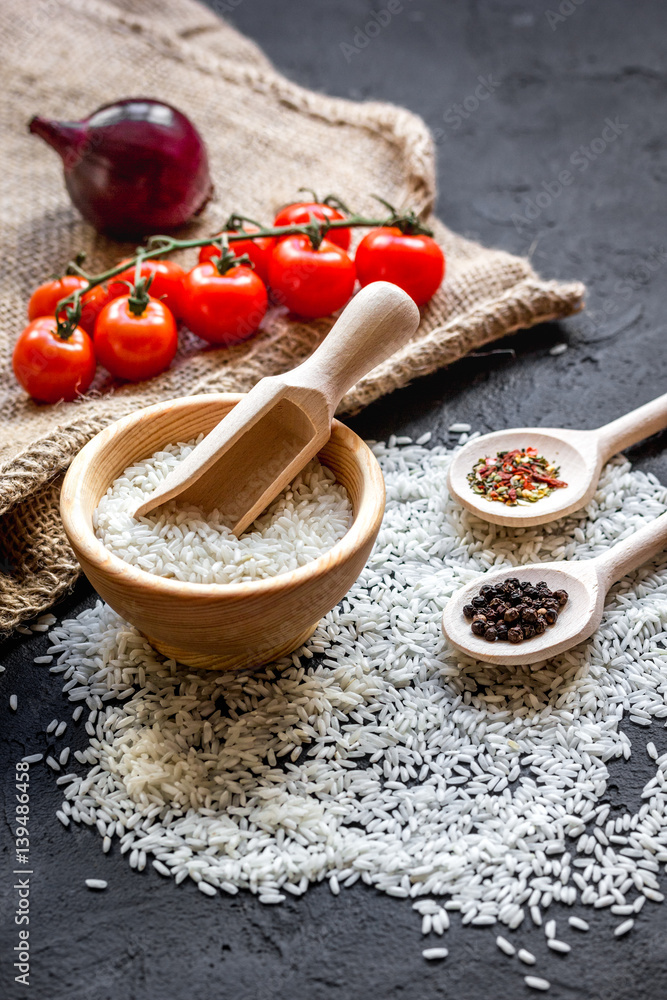 ingredients for paella on dark background