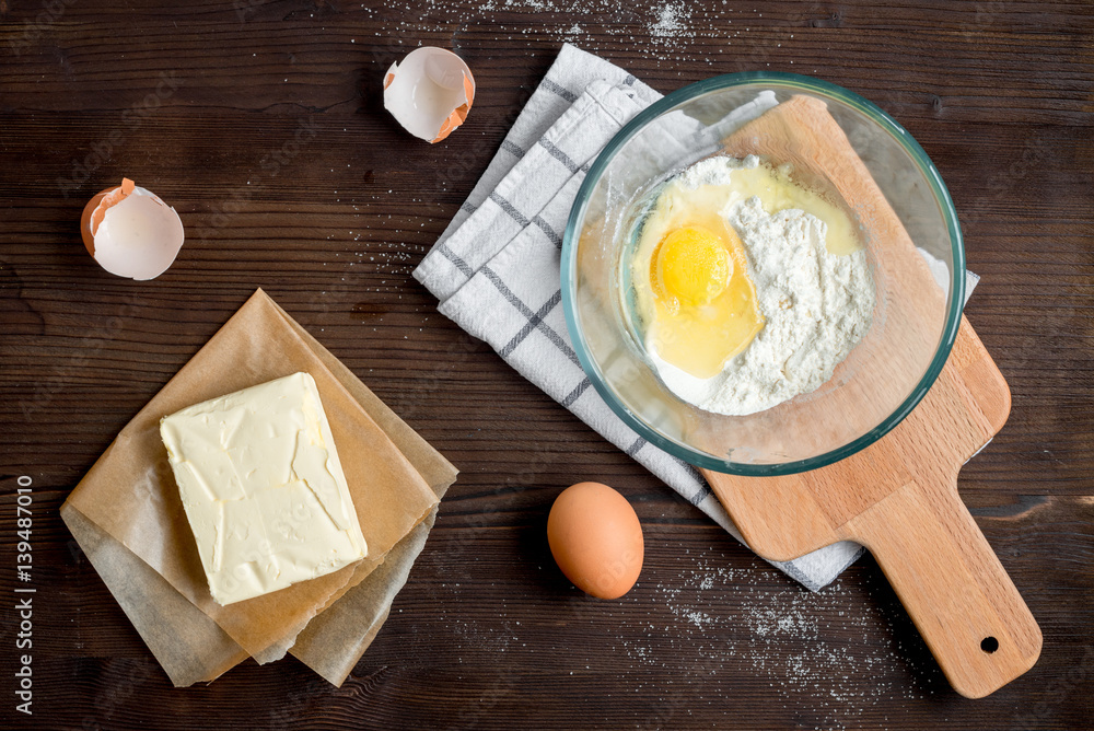 cooking pancake on wooden background top view ingredients for making