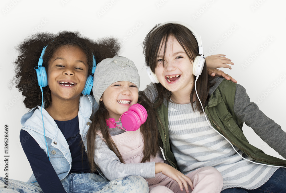 Group of Little Girls Studio Smiling Wearing Headphones and Winter Clothes