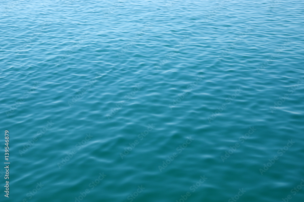 Blue sea surface with waves