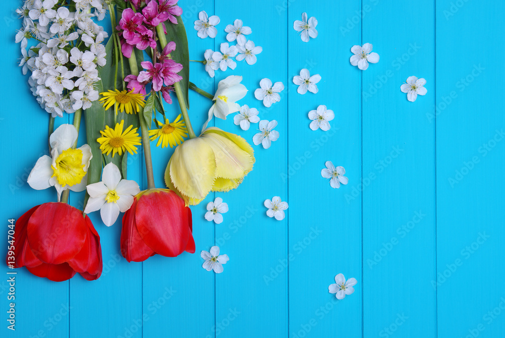 Tulips on a wooden background