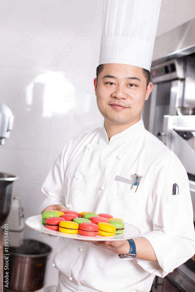 young man chelf makes food in kitchen