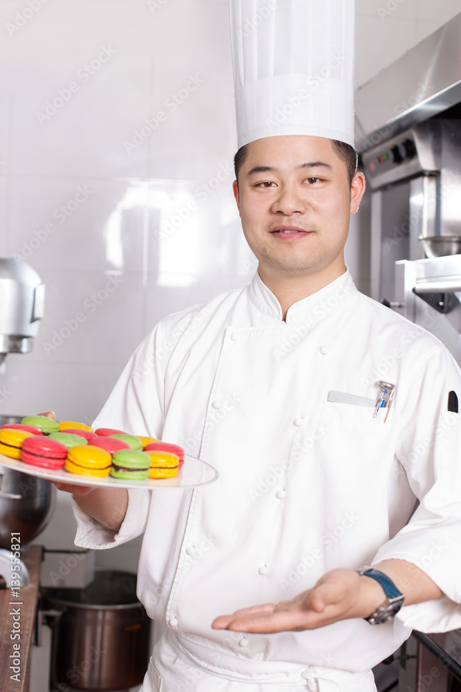 young man chelf makes food in kitchen