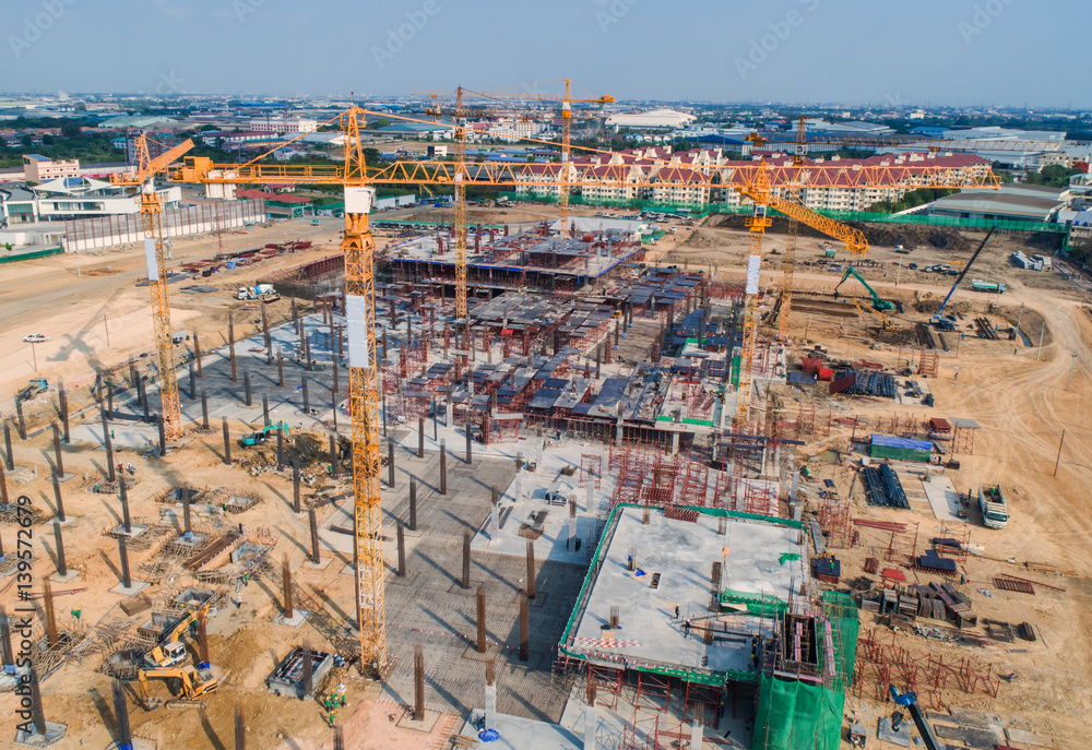 Construction site with cranes. Construction workers are building.Aerial view.Top view.