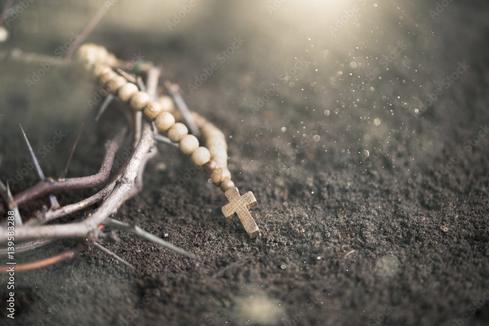 Cross on dirt.