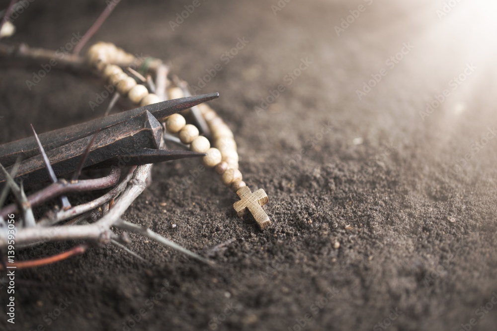 Cross on dirt.