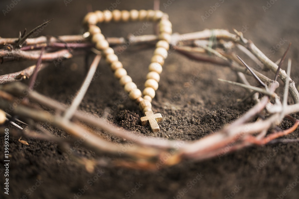 Cross on dirt.