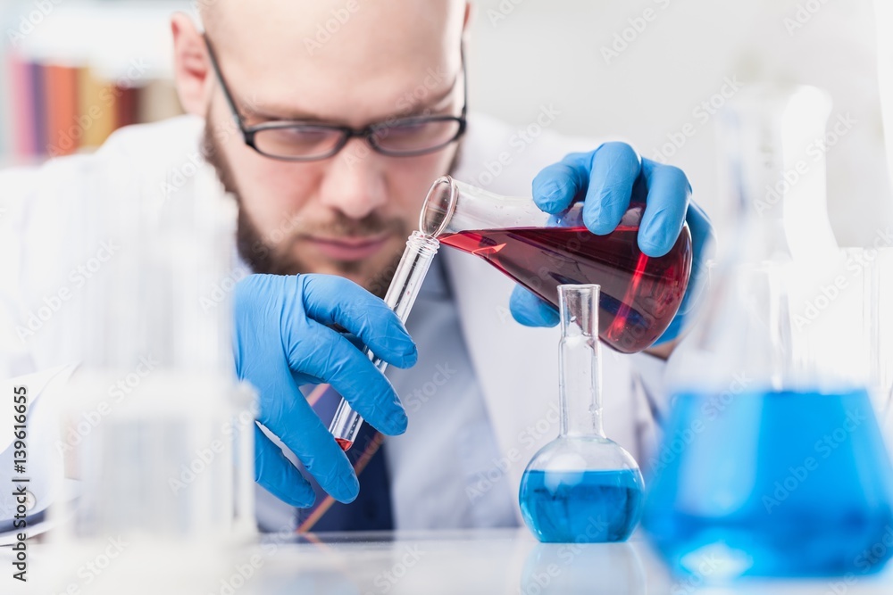 Man researcher carrying out scientific research.