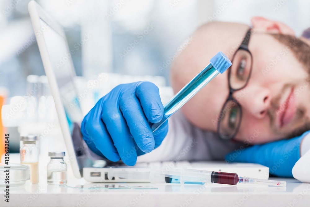 Man researcher carrying out scientific research.