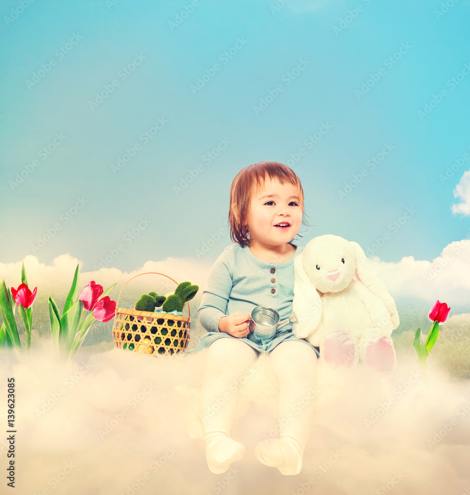 Toddler girl with white bunny