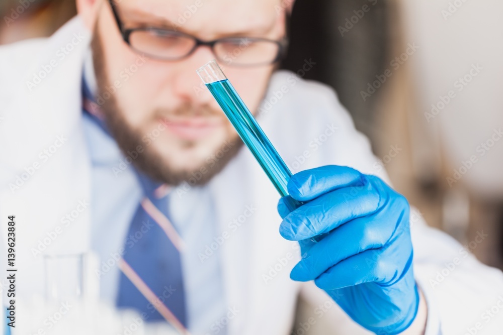 Man researcher carrying out scientific research.