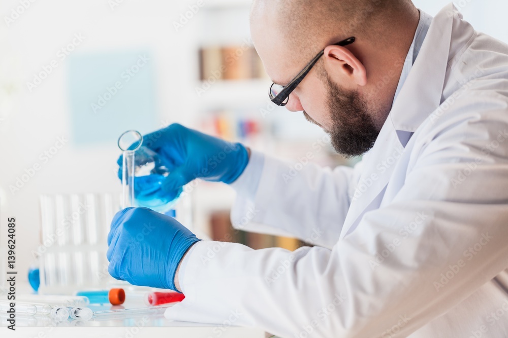 Man researcher carrying out scientific research.