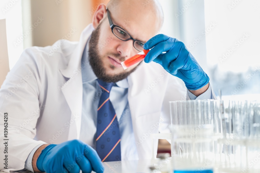 Man researcher carrying out scientific research.