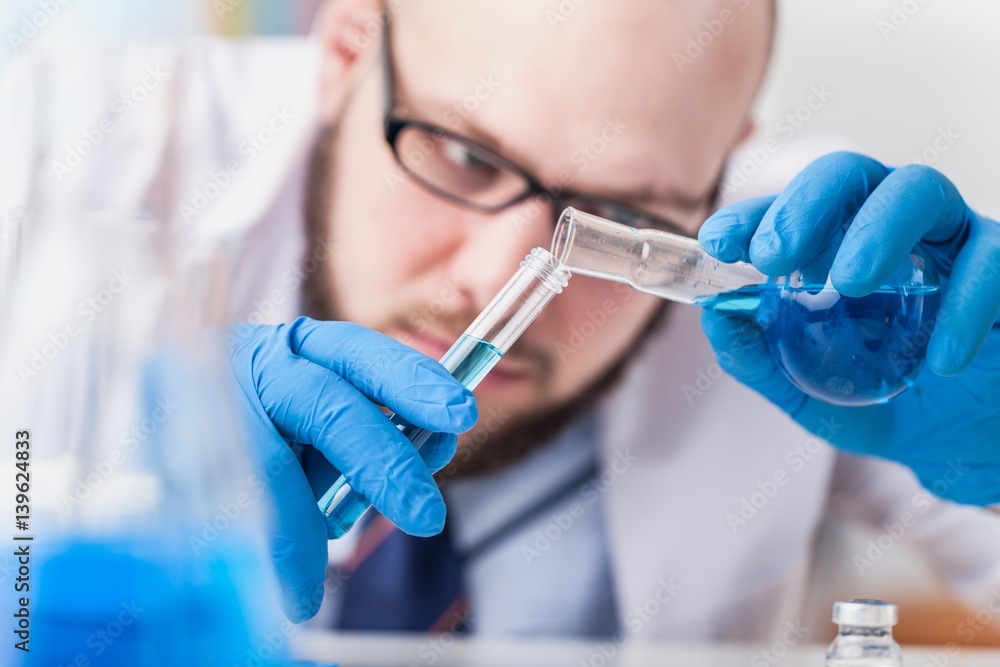 Man researcher carrying out scientific research.