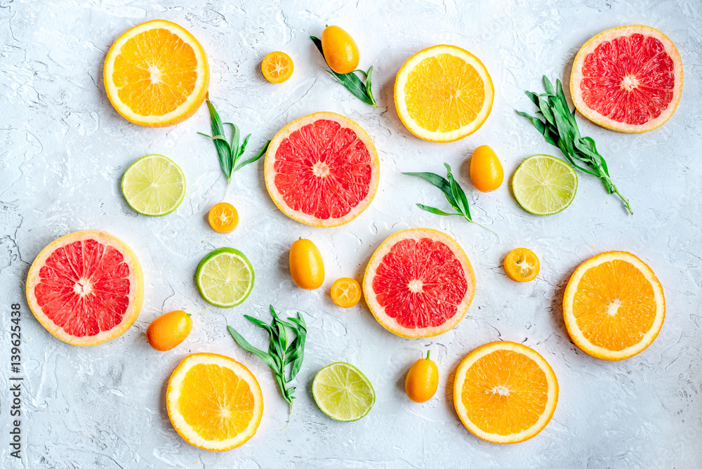 sliced citrus pattern on stone table background top view