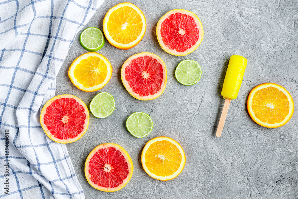 Orange icecream with fruits on table background top view