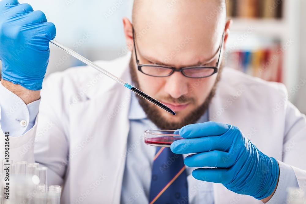 Man researcher carrying out scientific research.